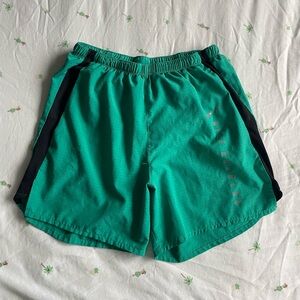 Green men’s Nike running dri-fit shorts